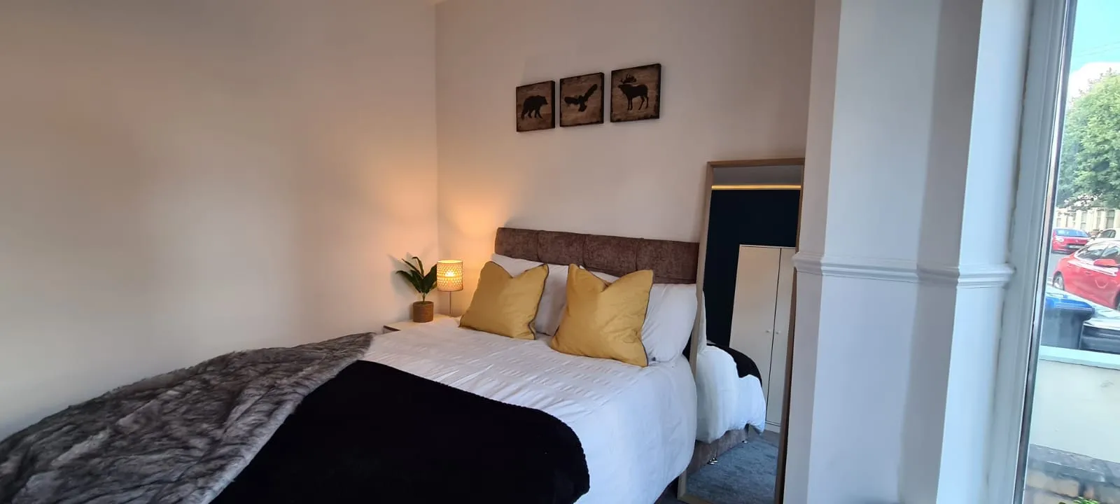 Finished HMO bedroom with furnished bed and large window